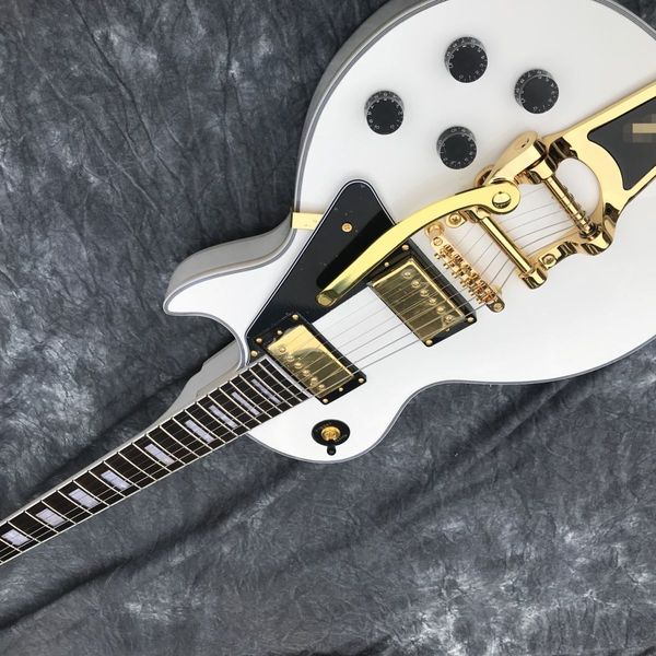 

white large rocker distortion ebony fingerboard gold hardware guitar