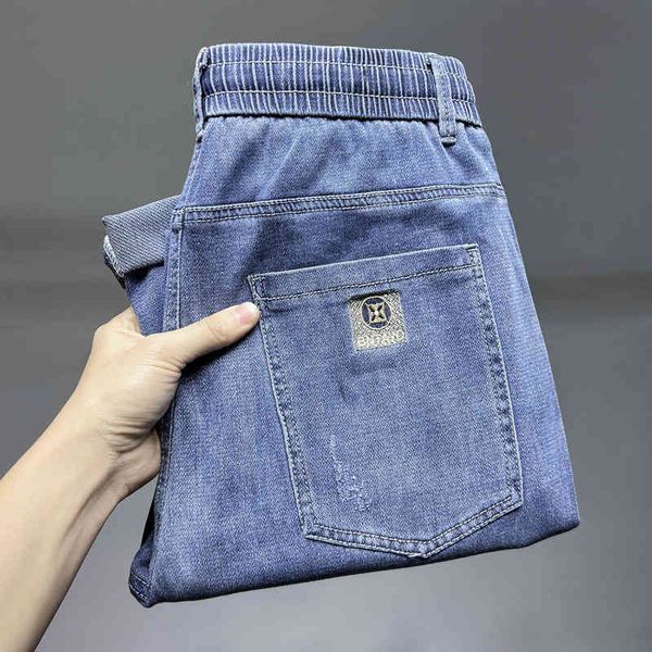 

men's jeans summer men's jeans korean version tide brand small foot slim fit cotton elastic light blue embroidered denim capris g1