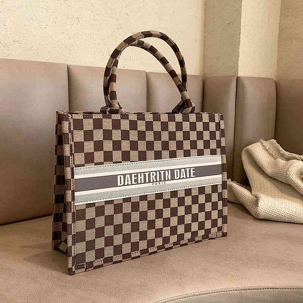 

2022 factory wholesale new high sense female fashion woolen one shoulder tote bag autumn and winter retro commuter large bag