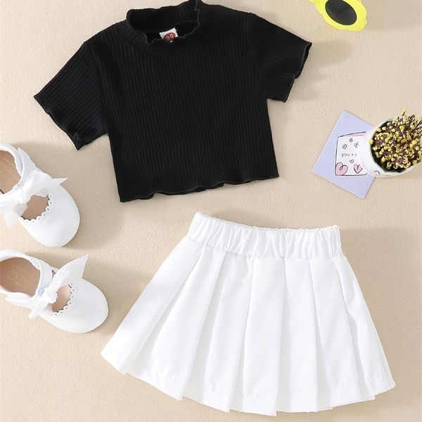

little girl's ear edge small high neck t-shirt and pleated skirt she, White