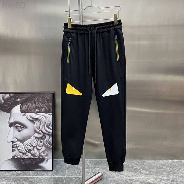 

men's pants designer 2022 summer new little monster eye badge leather contrast color slim fit foot men's sports leisure pants tren, Black