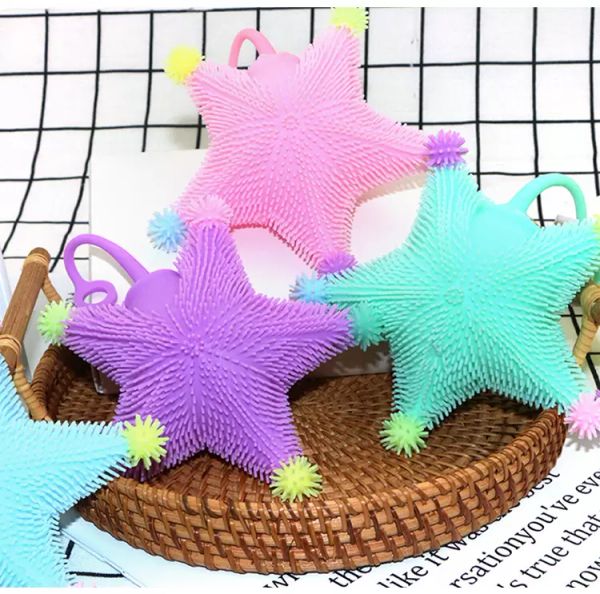 Gomma morbida TPR allevia le bocchette di pressione Led Flash Starfish Fune elastica Agitarsi Giocattolo palla pelosa piccole cinque stelle Giocattoli