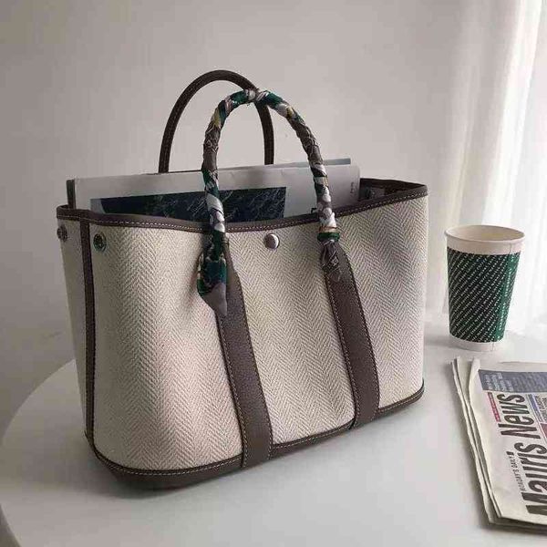 

large capacity new canvas with cowhide head bag garden party casual hand one-shoulder miaoqibags color slant tote