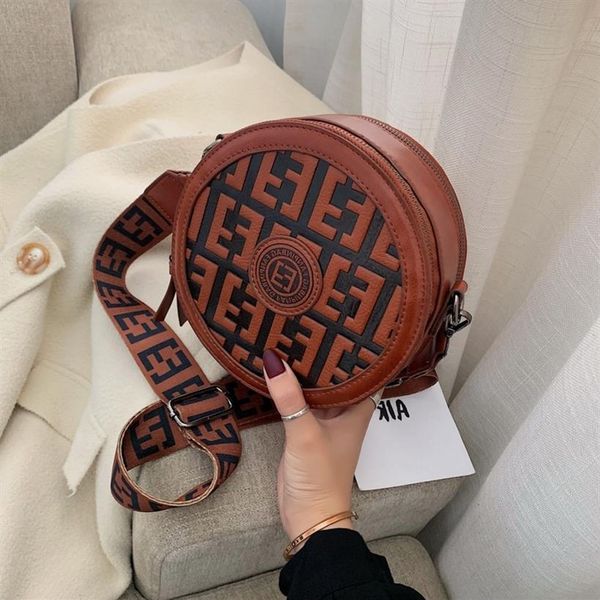 

new fashion small round circle bag new wide shoulder strap cross carrying one leisure women's backpack indentation letter265g