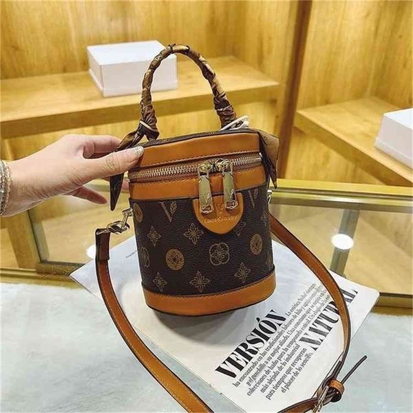 

super low flower spring and autumn portable bucket diagonal cross small commuter single shoulder cylinder bag factory store online
