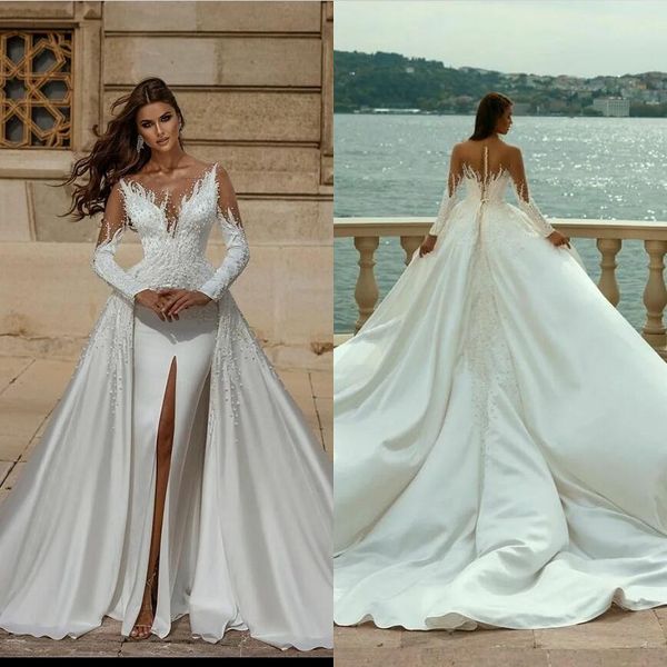 Arabia Saudita Perline Abito da sposa a sirena Sheer Scollo a V Manica lunga Perle di lusso Spacco sul davanti Abiti da sposa Abiti da sposa in cristallo