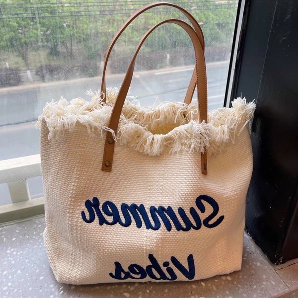 

designer bags 2022 new handbag simple niche beach travel tassel tote large capacity one shoulder fashion