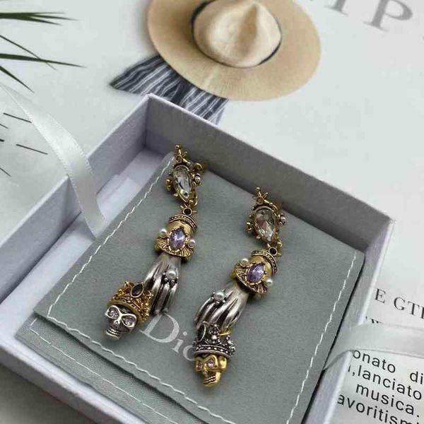 

2022 factory wholesale new maijia crown skull ghost hand dark female atmosphere personality exaggerated earrings, Golden
