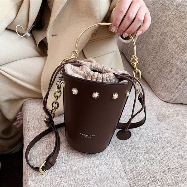 

designer bags high sense small water cup 2022 new fashion shoulder foreign style simple messenger korean bucket women's