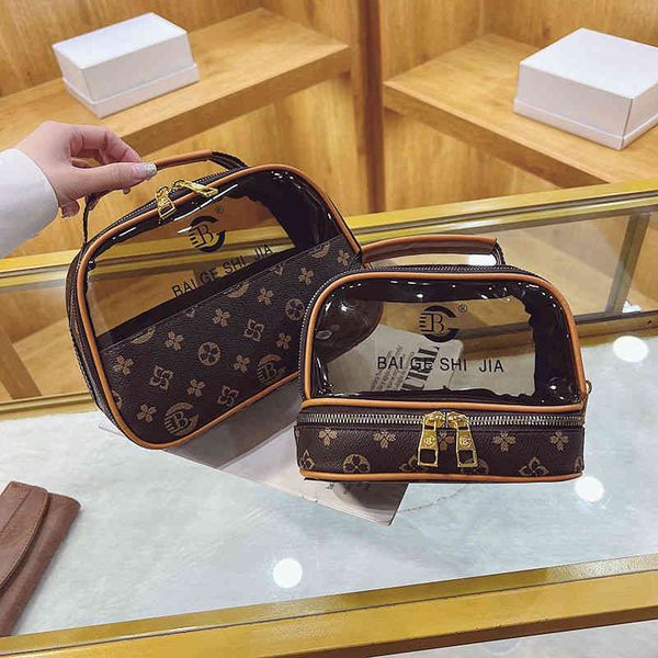 

2022 factory wholesale new cosmetic female old flower large capacity super fire waterproof transparent high-grade feeling portable wash bag