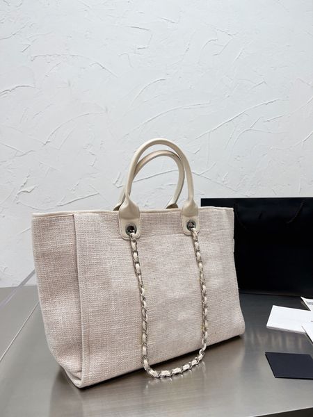 

2022 new hand-held leather chain bag small fragrance canvas pearl beach shopping bag large capacity shoulder bag women