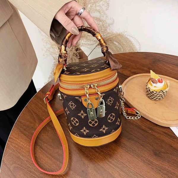 

2022 factory wholesale new old flower silk scarf drum vintage printed portable women's bag versatile small public messenger bucket bag