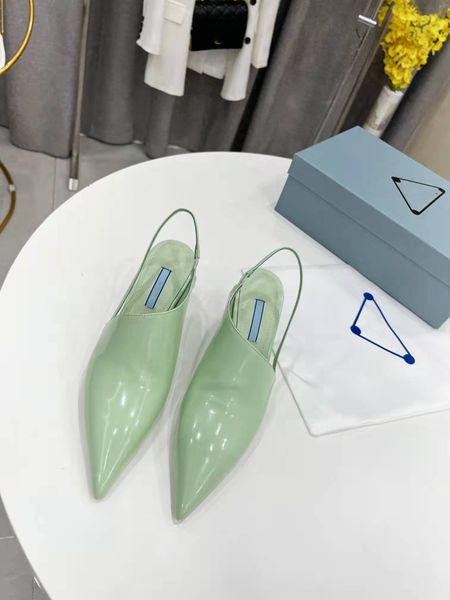 

the sandals have a pointed toe and a modern wedge heel that's beautifully painted and glossy leather to create clean, clean lines, Black