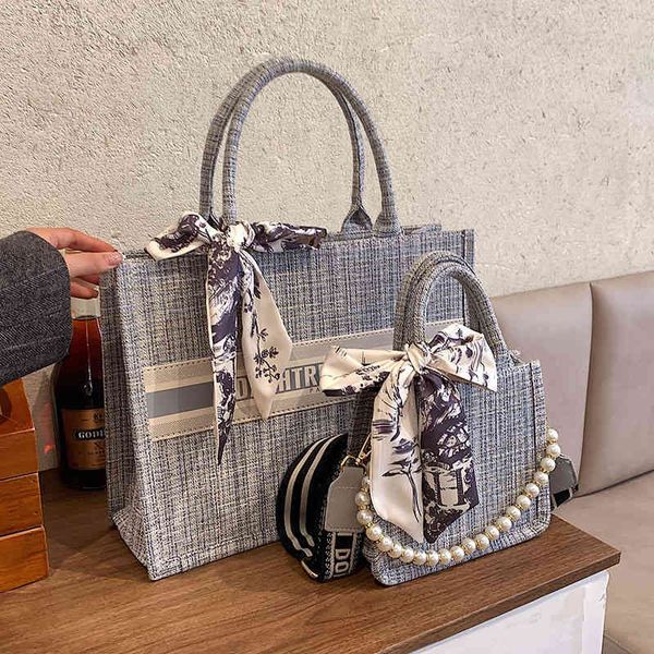 

2022 new designer handbags high version tote bow knot high sense canvas capacity autumn and winter minority