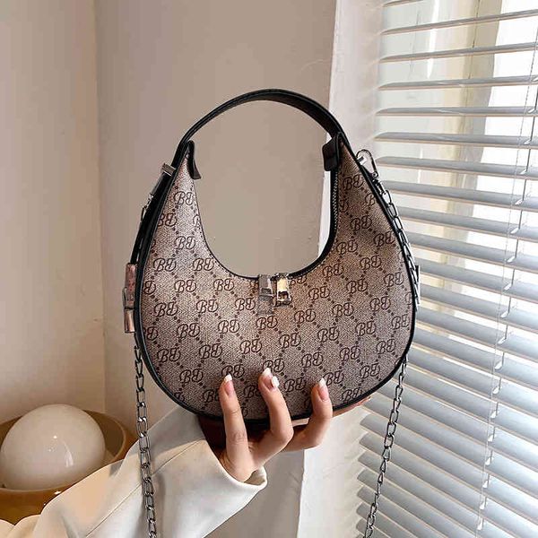 

factory direct 65% off moon female summer 2022 new french minority hand sense ins printed messenger bag