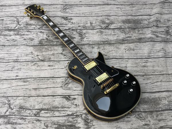 

70s black custom electric guitar, binding over frets