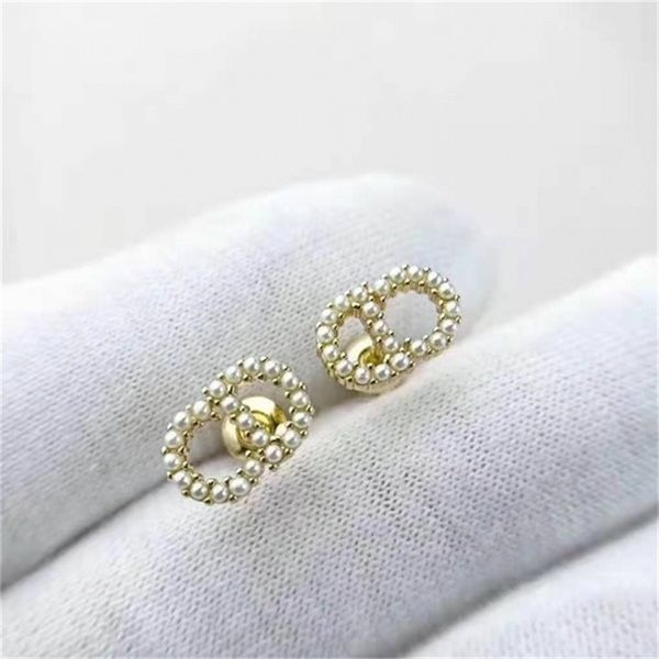 

2022 20% off designer jewelry d family classic inlaid small pearl light gold letter 925 silver needle front and back earrings, Golden