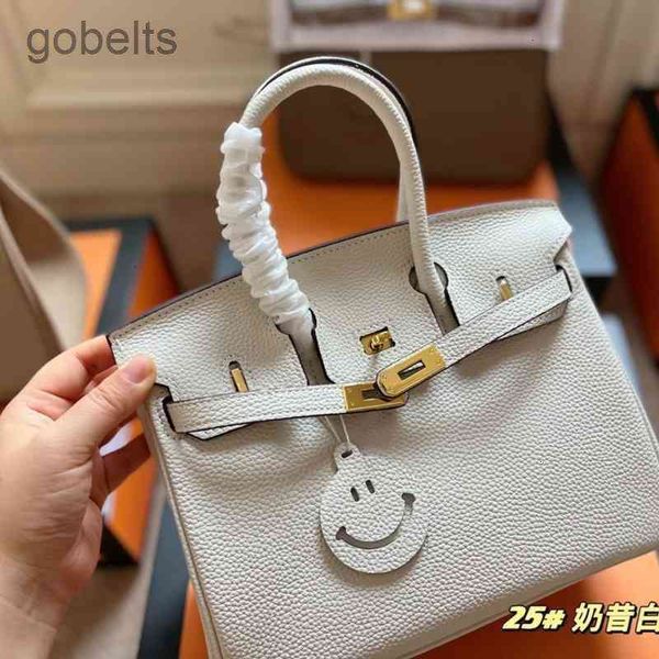 

2022 designer bags 2022 spring new first layer cowhide platinum year war smiling face accessories handbag commute versatile fashionbirkins