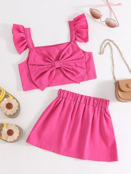 

little girl's ruffled front bow and skirt she, White
