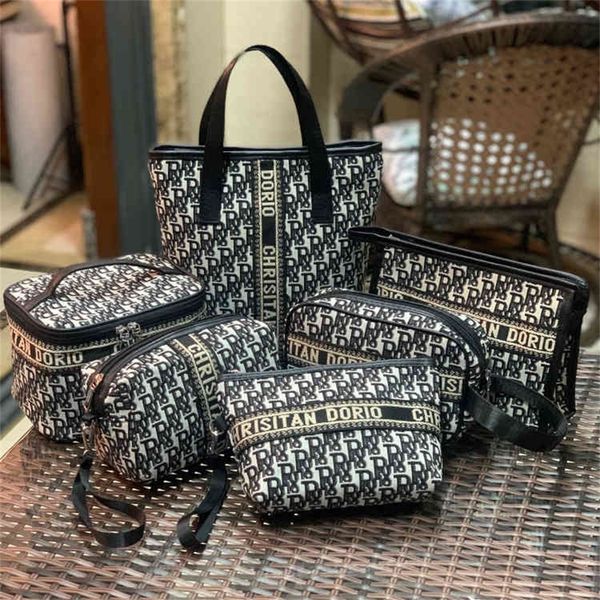 

new alphabet large capacity cosmetic storage portable washing women's travel cosmetic design purses online