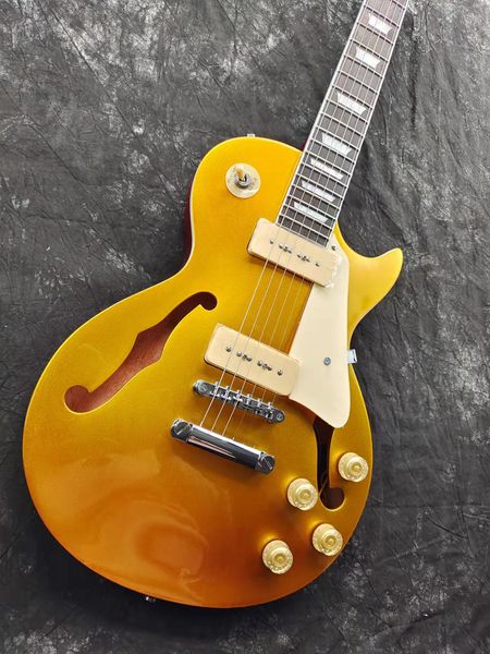

electric guitar, f hole, golden shiny, fingerboard binding