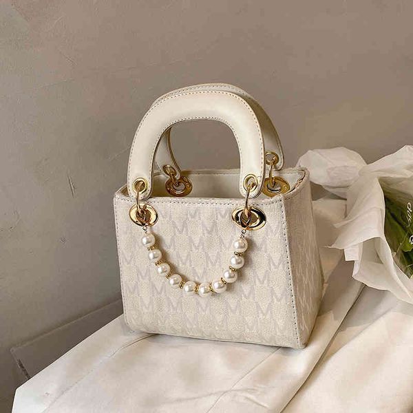 

women's handbag with small fragrance and luxury designer