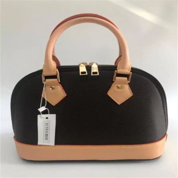 

classic semi-circular bag with hand-held metallic trim in brown