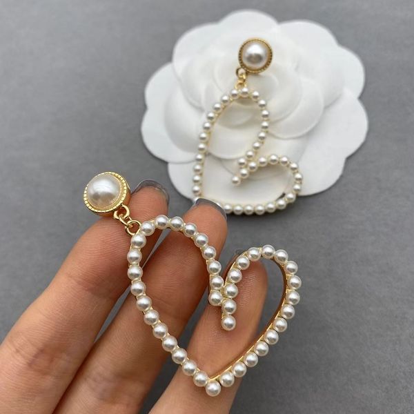 

2022 luxury jewelry family love pearl earrings female high-grade temperament hollow heart earringsnew jewellery, Golden;silver
