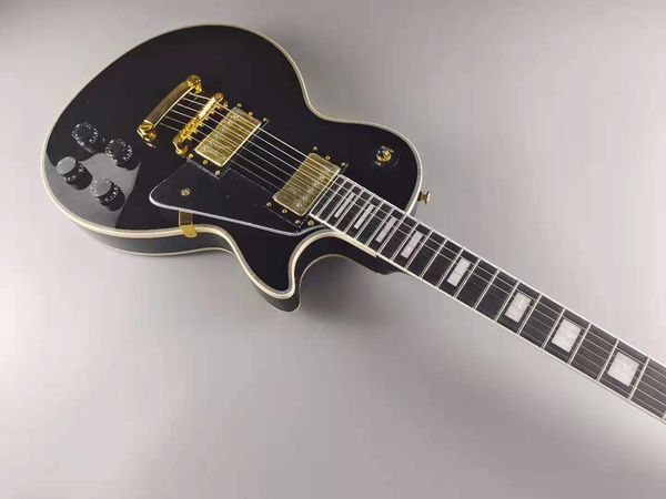 

electric guitar, mahogany body, ebony binding, golden tune o matic bridge and golden accessories, in stock