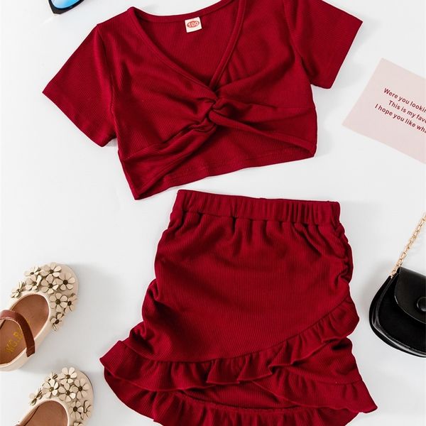 

little girl's twisted t-shirt and ruffle front short back long skirt she, White