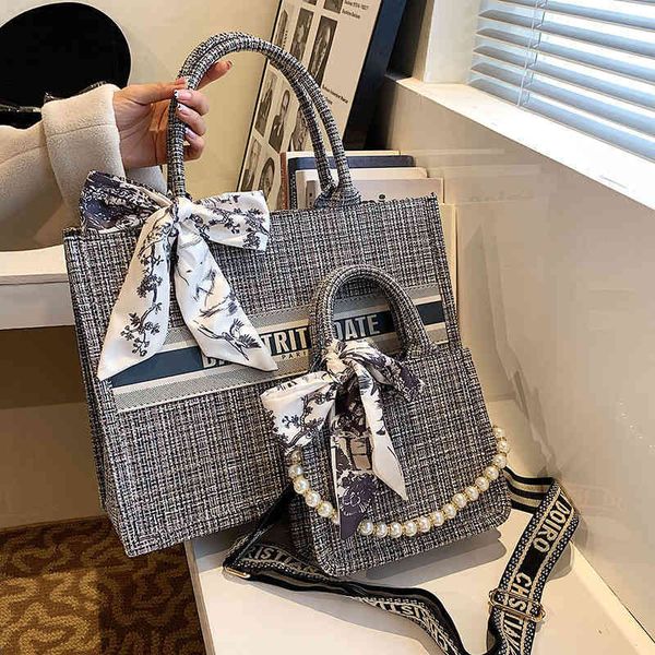 

2022 new designer handbags quality tote bow knot high sense canvas large capacity hand women's autumn and winter new minority letter