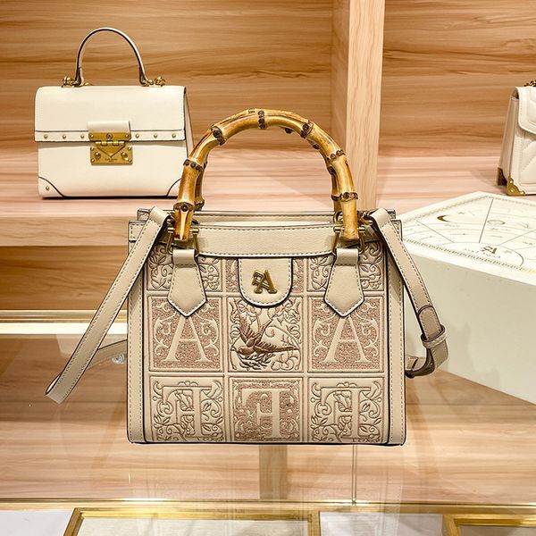 

new designer bags angel face women's live broadcast tote high-level feeling commuter bamboo knot portable one shoulder messenger