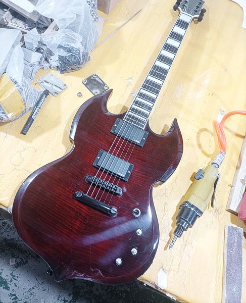 

6 strings wine red unusual shaped electric guitar with rosewood fretboard