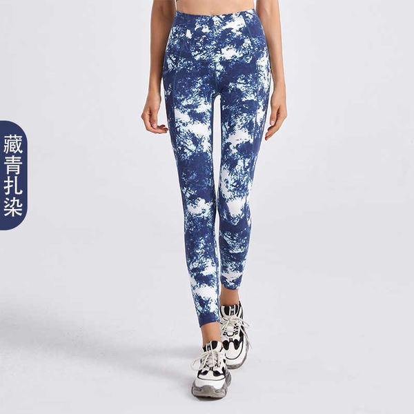 Camouflage Tie Dyed Yoga Outfits Leggings Vita alta da donna Sollevamento dell'anca Abbigliamento da palestra Pantaloni da fitness a doppia tasca Indossare collant a nove punti