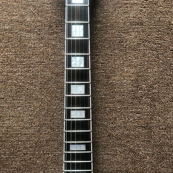 

electric guitar,decaying wood,zebra pickup,black hardware