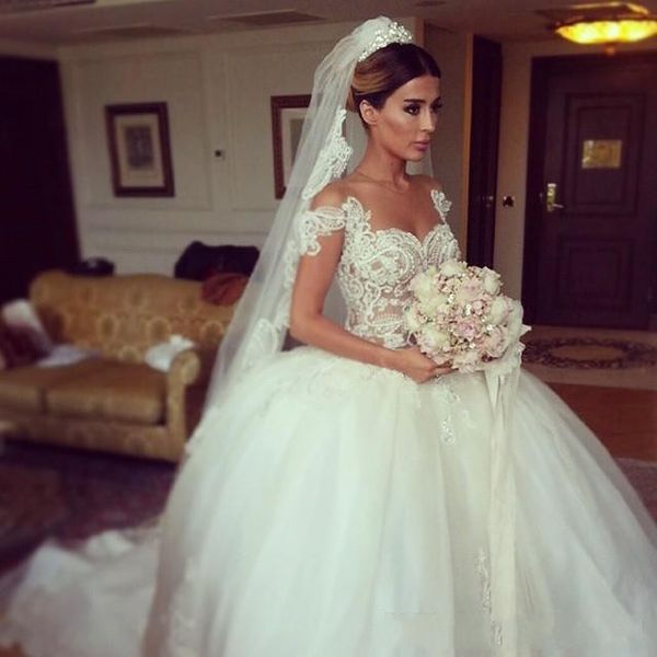 

arabic 2016 wedding dresses lace sheer bridal gowns princess ball gown v neck cap sleeve tulle skirt covered button bride gowns saudi, White