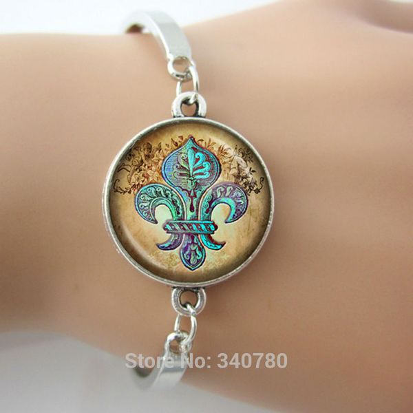 

Fleur de Lis bangles with Cherubs Aqua on Tan Parchment Vintage-Inspired Handcrafted Keepsake Pendant Art Nouveau silver bangles
