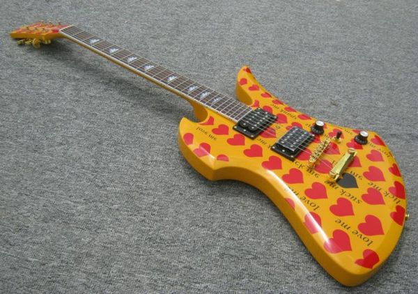 

a new brand electric guitar organe yellow with red heart decal