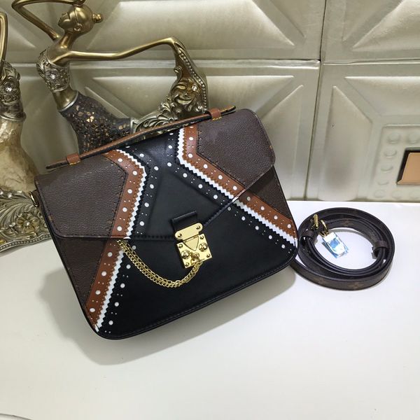 

Classical style the well-known Brogue pattern to the Pochette Metis with double Golden key chain decoration shouder bag handbag day clutch