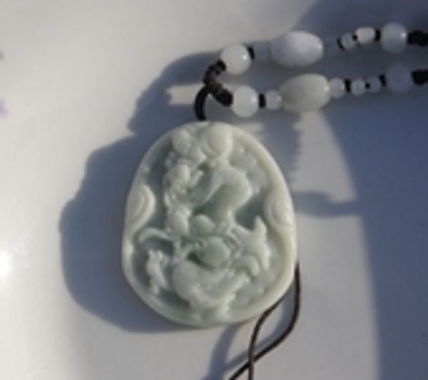 

white jade hand carved the dragon world talisman necklace pendant (oval), Silver