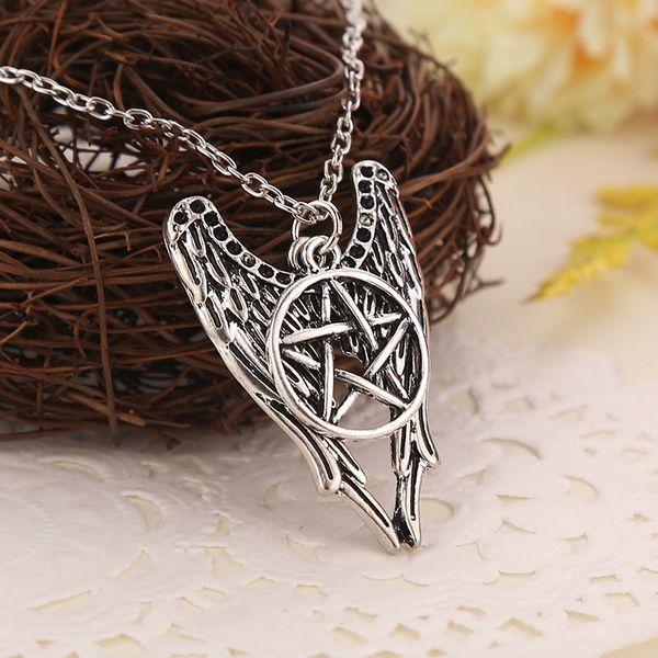 

supernatural necklace castiel wings angel necklace chain charm in silver wings angel wicca silver supernature pentacle