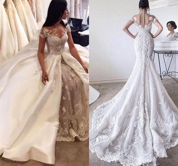 

2017 new luxury overskirts long mermaid wedding dresses jewel neck illusion cap sleeves lace appliques crystal beading pearls bridal dress, White