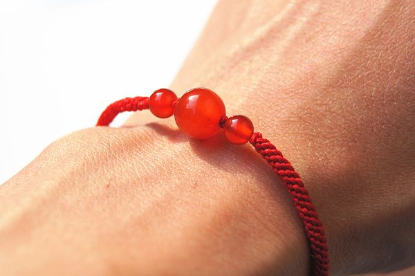 

pure manual weaving red king kong garden ball onyx beads bracelet., White