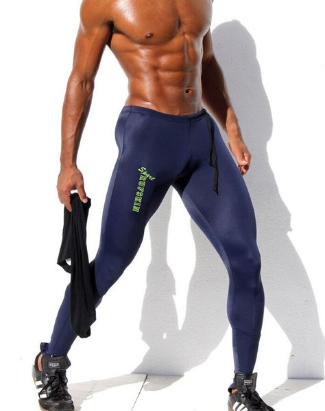 Atacado-moda mens calças de compressão baixa ascensão caneca de calça de poliéster elástico homens homens skinny calças Mallas hombre molham calças