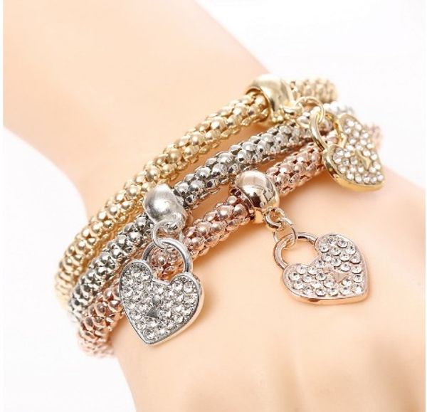 

trendy corn bracelet set for girls/ladies heart pendant three in one gold /silver /rose gold elastic rope chain bracelet sets, Golden;silver