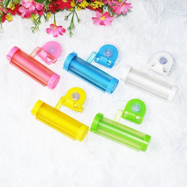 

wholesale- 5 colors plastic rolling tube squeezer useful toothpaste easy dispenser, bathroom toothpaste holder, bathroom accessories