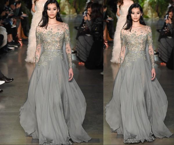 

Новый Elie Saab Вечерние платья Sheer Длинные рукава Иллюзия из бисера Кристалл Вечерни