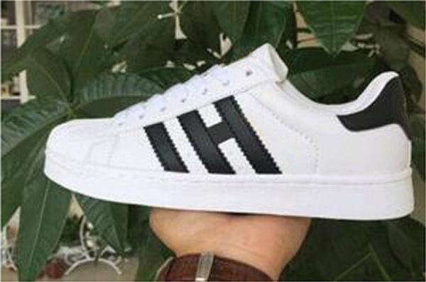 

Высокое качество мода женщины мужская Повседневная обувь суперзвезда женские пл