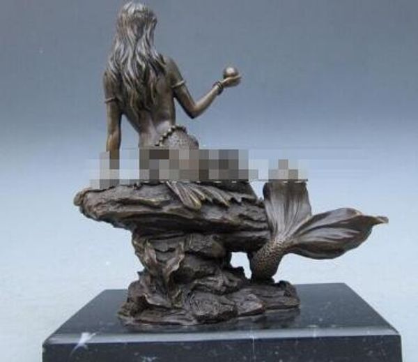 

mermaid hold pearl sit on the rock pure bronze statue