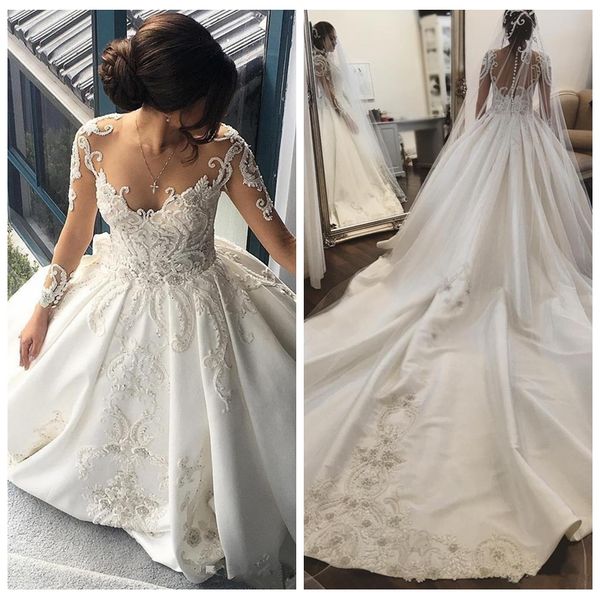 

Vestidos De Mariee Роскошное прозрачное бальное платье с длинными рукавами Свадебные платья Собор Поезд Кружева Аппликации из бисера Сад Свадебные платья 2018